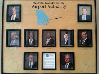 Pictures of authority members on the wall at the airport