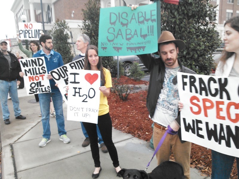 Disable Sabal!!! No New Pipelines!!! (Blake Clark), Wind Mills, Not Oil Spills (Ben Vieth), in People v. Spectra @ LCC 2013-12-09, by John S. Quarterman, for Lowndes Area Knowledge Exchange (LAKE), 9 December 2013