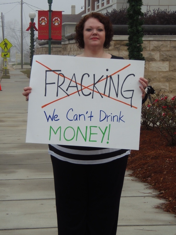 Andi Ray Drake (No Fracking; We Cant Drink Money!), in No pipeline no fracking: protest before Spectra at Lowndes County Commission, by Gretchen Quarterman, for Lowndes Area Knowledge Exchange (LAKE), 9 December 2013