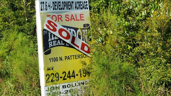 [Sold sign, 27.6+/- acres]