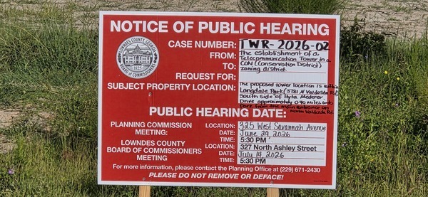 [Public Hearing sign on Hyta Mederer Drive, 2026:07:11 08:44:21, 30.8872157, -83.3165918]